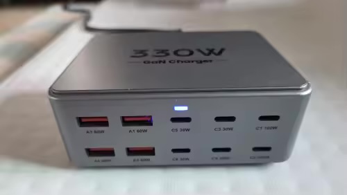 Front of the charging station with its status light on and ten ports visible