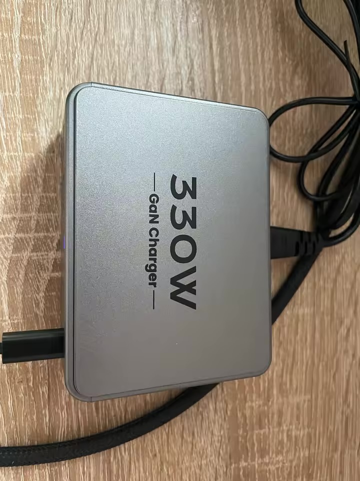 Top view of the PowerNorth 330W GaN charger sitting on a wooden desk